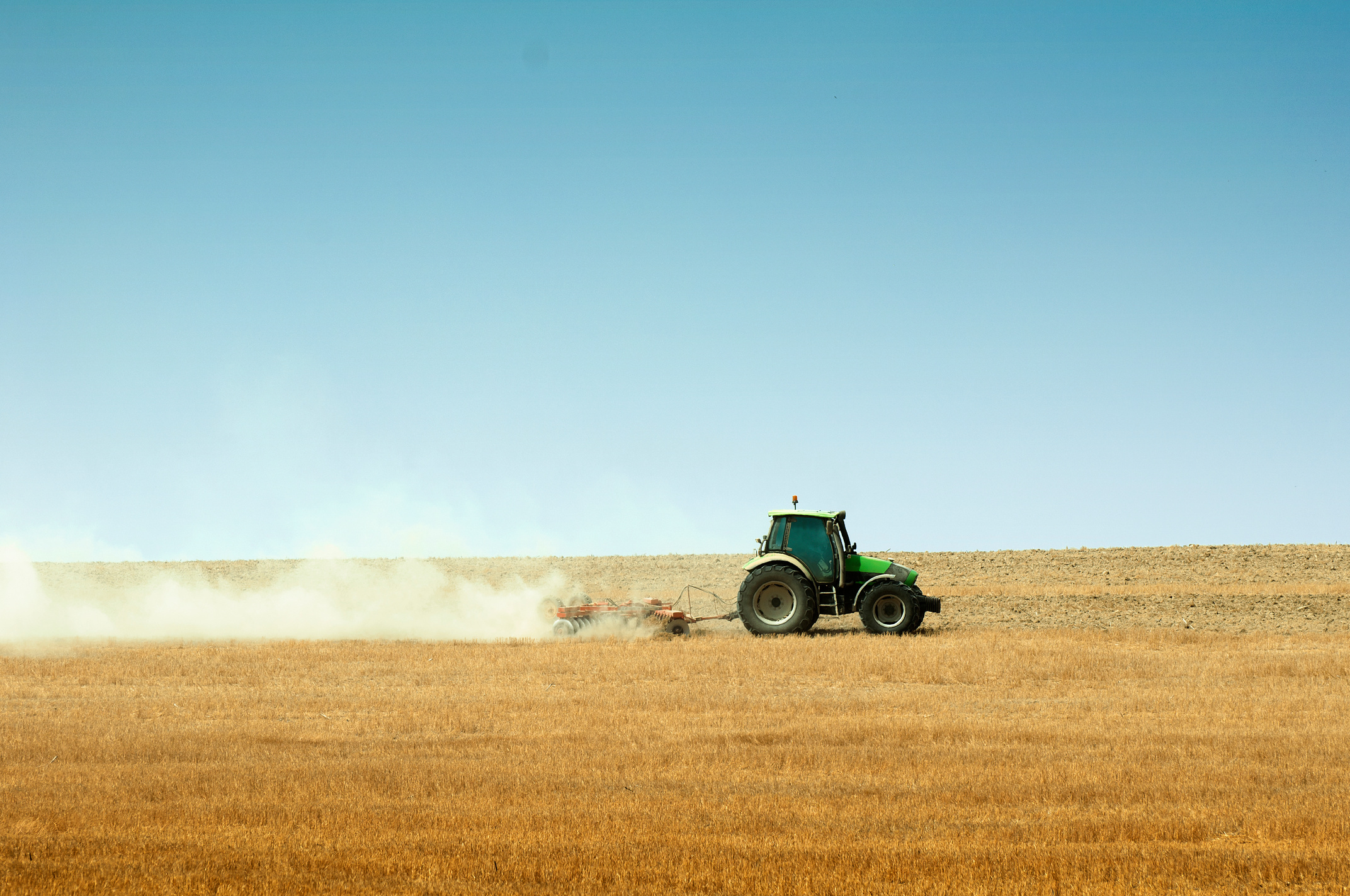 Tractor Plowing Field